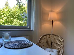 a table with a white table cloth and a window at Ferienvermietung Kallenbachtal in Löhnberg