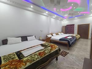 Ένα ή περισσότερα κρεβάτια σε δωμάτιο στο Sea Wave Beach Resort