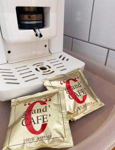 a coffee machine with two bags on a counter at NICE "TRABI" APARTMENT IN THE CITY in Budapest