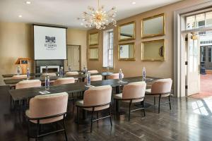 a conference room with a large table and chairs at St James Hotel Selma Tapestry Collection by Hilton in Selma