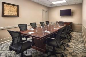 a conference room with a long table and chairs at St James Hotel Selma Tapestry Collection by Hilton in Selma