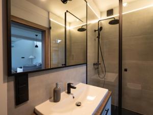 a bathroom with a sink and a shower at Rodzone Dolina 