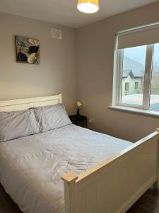 Voodi või voodid majutusasutuse Bay Area House, Spiddal toas