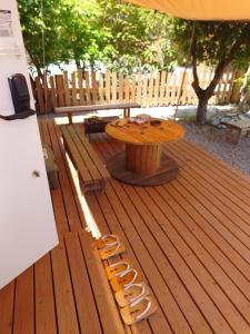 a wooden deck with a table and a bench at CampBaseKadojin - Vacation STAY 74181v in Tenkawa