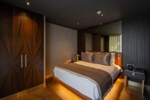 Postel nebo postele na pokoji v ubytování Merit Starlit Hotel & Residences