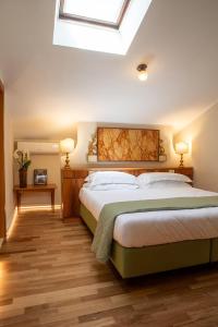 Ένα ή περισσότερα κρεβάτια σε δωμάτιο στο Villa Battibecco