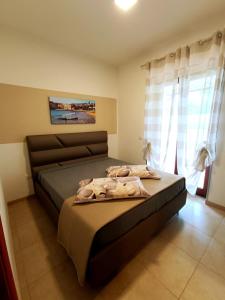 Postel nebo postele na pokoji v ubytování M&M Home