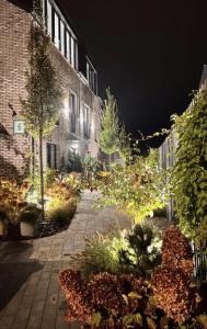a courtyard of a building at night at Salt Garden Apartments in Druskininkai