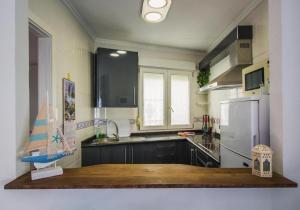 Kuchyň nebo kuchyňský kout v ubytování Casa ELI "Casa Marenga" A 50m de playa