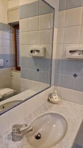 Koupelna v ubytování Hotel Dogana