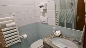 Koupelna v ubytování Hotel Dogana