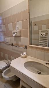 Koupelna v ubytování Hotel Dogana