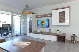 TV a/nebo společenská místnost v ubytování Residenz Waterkant