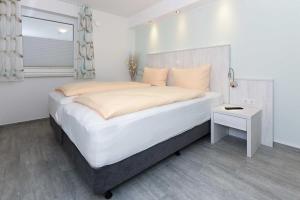 Postel nebo postele na pokoji v ubytování Residenz Waterkant