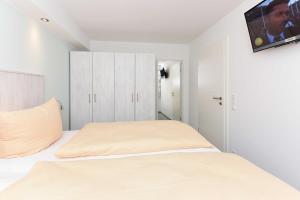 Postel nebo postele na pokoji v ubytování Residenz Waterkant