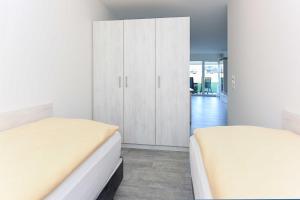 Postel nebo postele na pokoji v ubytování Residenz Waterkant