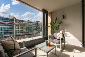 an apartment balcony with a view of a city at The Benson One by Dublin At Home in Dublin