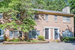 a brick house with a tree in front of it at NEW ENTIRE PLACE COZY QUIET 2b2b TOWNHOUSE SP1265 in Norcross