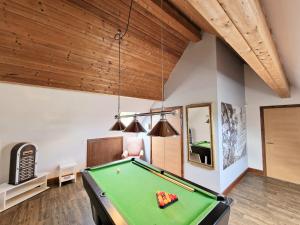 a pool table in a room with a ceiling at Lbtie Lodge with Two Private Hot Tubs - Fife - Loch Leven - Lomond Hills in Kelty