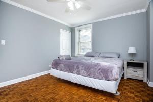 a white bedroom with a bed and a window at ENTIRE CONDO! Downtown! 24 Concierge! 9B in Atlanta