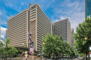 a tall building with a ribbon in front of it at ENTIRE CONDO! Downtown! 24 Concierge! 9B in Atlanta