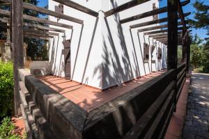 a porch of a house with wooden railing at Villa Olivia in Chania Town +33 photos