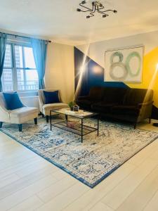 a living room with a couch and a table at Downtown Condo! Private Balcony! 10F in Atlanta