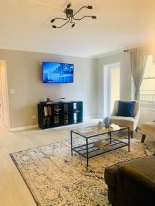 a living room with a couch and a table at Downtown Condo! Private Balcony! 10F in Atlanta