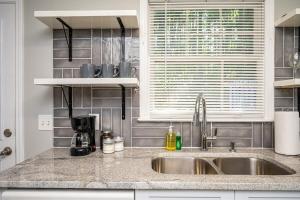 a kitchen counter with a sink and a window at NEW ENTIRE PLACE COZY QUIET 2b2b TOWNHOUSE SP1277 in Norcross