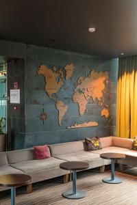 a mural of a map of the world on a wall at Hotel Panorama in Vilnius