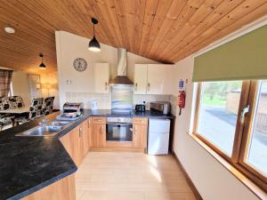 a kitchen with a sink and a counter top at Lomond 3 with Private Hot Tub - Fife - Loch Leven - Lomond Hills -Pet Friendly in Kelty