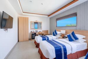 Postel nebo postele na pokoji v ubytování Ayala Oceanview Maldives