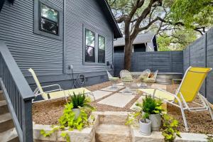 a backyard with chairs and a table and a house at Retro Austin Home S Congress Ave in Austin