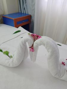 Postel nebo postele na pokoji v ubytování Dilhan Hotel