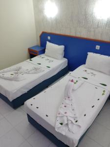 Postel nebo postele na pokoji v ubytování Dilhan Hotel