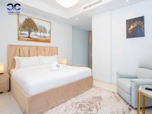 Ένα ή περισσότερα κρεβάτια σε δωμάτιο στο Paramount Downtown Burj Khalifa View with 64th floor Infinity pool +67 φωτογραφίες