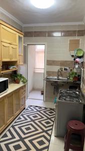 a kitchen with a sink and a stove in it at Gardinia city compound, Nasr city in Cairo