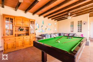 a living room with a pool table in it at Villa Airlie by Abahana Villas in Calpe