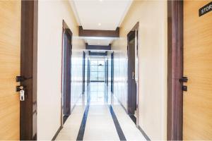 a corridor of an office building with a hallway at FabHotel Krishna Regency in Pune