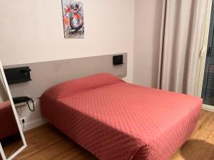 Postel nebo postele na pokoji v ubytování Hotel Maquis et Mer