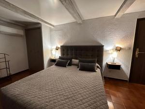 Postel nebo postele na pokoji v ubytování Hotel Maquis et Mer