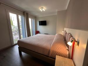 Postel nebo postele na pokoji v ubytování Hotel Maquis et Mer