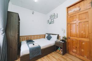 Postel nebo postele na pokoji v ubytování AN TÂM House Đà Lạt