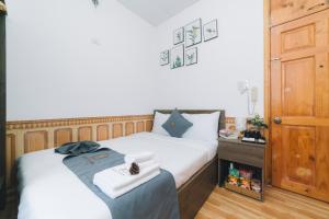 Postel nebo postele na pokoji v ubytování AN TÂM House Đà Lạt