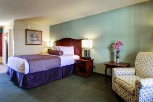 Säng eller sängar i ett rum på Key West Inn - Tunica Resort
