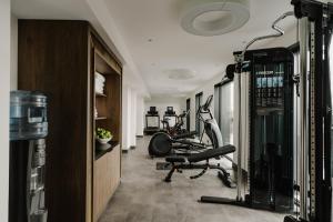 a gym with several exercise bikes in a room at The Halyard Liverpool, Vignette Collection, an IHG Hotel in Liverpool