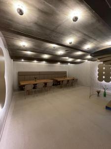a conference room with tables and chairs and lights at SKLEP 38 in Velké Bílovice +165 photos