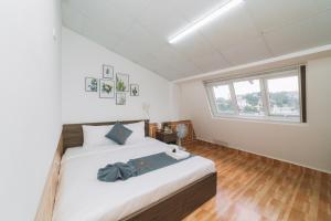 Postel nebo postele na pokoji v ubytování AN TÂM House Đà Lạt
