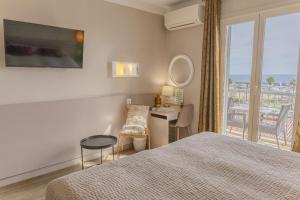 Postel nebo postele na pokoji v ubytování Hotel Maquis et Mer