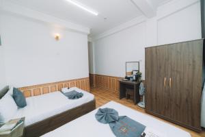 Postel nebo postele na pokoji v ubytování AN TÂM House Đà Lạt